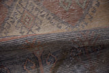 Worn pile texture of distressed Oushak runner, showing foundation, faded ivory and brick.