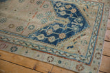 Textured distressed vintage Anatolian rug with indigo stepped contour and geometric vinery.