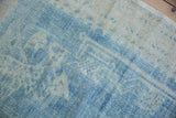 Distressed hand-knotted texture showing even wear to the knot heads in dusty blue and ivory.