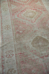 Vintage Oushak runner with distressed texture, even pile wear, and dusty raspberry geometric patterns.