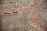 Distressed dusty raspberry and beige geometric pile meets hand-knotted Oushak rug foundation.
