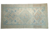 Distressed vintage Oushak carpet with faded powder blue and ivory geometric medallions, 5x9.5.