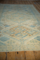 Distressed Oushak rug showing soft powder blue and ivory geometric motifs with even wear.