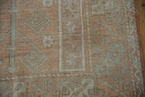 Vintage distressed Melas rug, even wear to knot heads in terra cotta, seafoam, ivory.