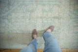 Textured distressed Oushak runner featuring faded pale blue and ivory geometric patterns.