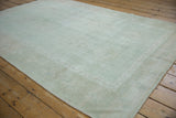 Distressed seafoam green Oushak rug, highlighting worn texture and subtle color abrashes.