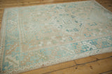 Distressed vintage Melas rug close-up, highlighting even wear and powder blue geometric motifs.