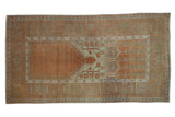 Vintage distressed Oushak rug with copper, pale sea foam, and prayer niche design.