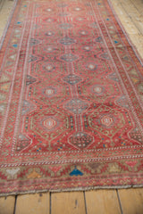 Distressed Oushak runner detail showing raspberry hexagonal medallions and thick vinery.