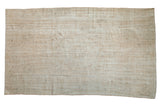 Distressed Oushak carpet with faded cream, ivory, beige medallion and palmette motifs.