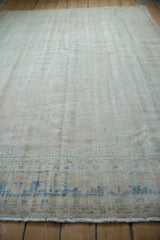 Worn knot heads and low pile texture of a distressed vintage Oushak carpet.