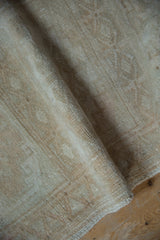 High luster and soft, distressed wool pile of a vintage Turkish Oushak rug.