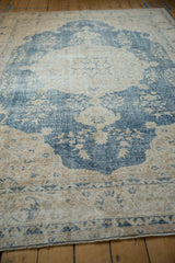 Textured wear and dusty denim blue pattern on the vintage distressed Sparta carpet.
