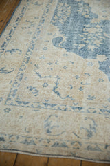 Ivory and dusty denim blue vintage Turkish Sparta rug, distressed pile with visible foundation.