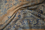 Distressed vintage Oushak rug detail showing even wear, faint foundation, blue and apricot tones.