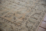 Distressed vintage Turkish Oushak rug's pile, showing chocolate brown border details.