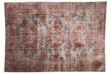 Hand knotted distressed Oushak carpet, triple medallions, red, midnight blue, and antique ivory tones.