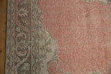Distressed rose abrashed field and patterned corner of a vintage Sparta carpet.