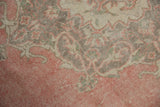 Distressed rose, silver, and ivory colors with even wear on a vintage Sparta carpet.