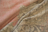 Distressed pile showing faint foundation and muted rose, ivory patterns.