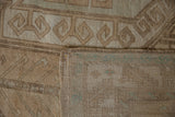 Vintage distressed Oushak rug's hand-knotted reverse with blue-green threads and low pile.