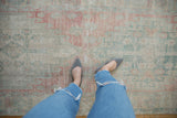 Distressed Oushak runner with abrash, showcasing faded rose and ocean green patterns.
