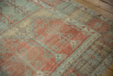 Even wear across the knot heads showing the texture of a distressed Oushak runner's pile.