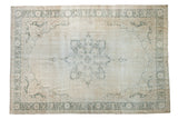Distressed Turkish Sparta carpet, ivory field with muted charcoal medallion and spandrels, 7'1