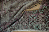 Distressed Oushak runner pile texture with aubergine, mint geometric motifs, and fringe.