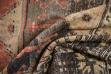 Distressed Oushak runner pile texture with charcoal, burnt orange, and pale ivory hues.