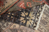Hand-knotted Distressed Oushak runner pile and reverse, with charcoal, saffron, and brick red.