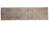 Distressed Oushak runner, faded ivory, beige, and charcoal medallion design. 3' x 11'3