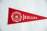 Vintage Indiana University red felt pennant with school crest and white lettering.