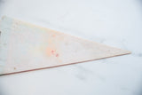 Close-up of the vintage Indiana felt flag's reverse side, showing texture and small pinholes.