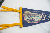 Yellow felt ties and 'Glass Bottom Boat' text on the vintage pennant's left side.