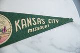Textured deep green felt banner with cream Kansas City Missouri lettering.