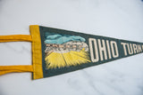 Close-up of the mid-century toll booth graphic on the vintage Ohio Turnpike felt pennant.