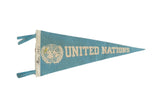 Vintage 1960s United Nations felt flag, robins egg blue with white logo, 6x13 inches.