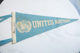 Vintage United Nations felt pennant, robin's egg blue, with 'Nov. 1961' handwritten on trim.