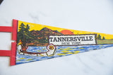The Tannersville, New York text and scenic canoe illustration on the vintage felt flag.