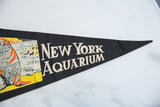 Black felt New York Aquarium pennant with cream lettering and light vintage creasing.