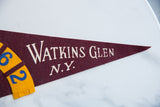 Maroon felt pennant tip with white 'Watkins Glen N.Y.' lettering.