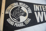 Black and aged cream felt pennant detail, zebra graphic, 'International Wildlife Park'.