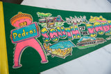 Green felt vintage Pedro's South of the Border flag, pink character, retro graphics.