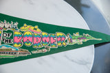Vintage Pedro's felt flag with colorful retro 'BORDER' text, sombreros, and golf scene.