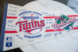 Classic logos and printed player signatures on the vintage 1987 Twins World Series felt flag.
