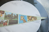 Vintage felt pennant tip showing detailed photo graphics of a giraffe and a pair of lions.