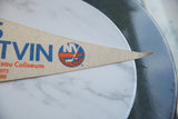 Textured beige felt pennant tip, featuring blue and orange NY Islanders logo.