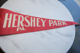 Detail of the vintage block lettering on the red felt Hershey Park PA pennant.