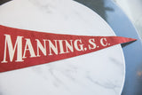 Vintage red felt pennant detail, featuring white 